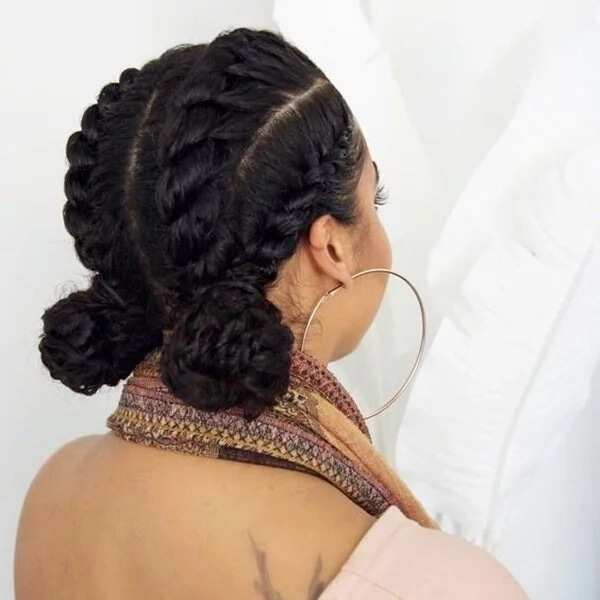 Four flat twists into two low buns