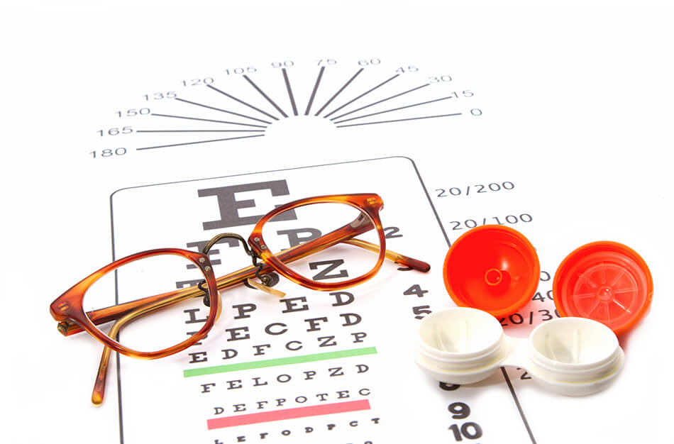 Contact lenses and eye glasses on eye-chart